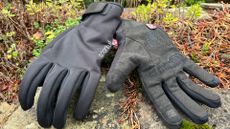 A pair of the Sportful Deep Winter Gloves shown laying on some greenary 